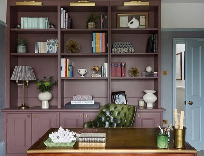 An office with a plum bookshelf