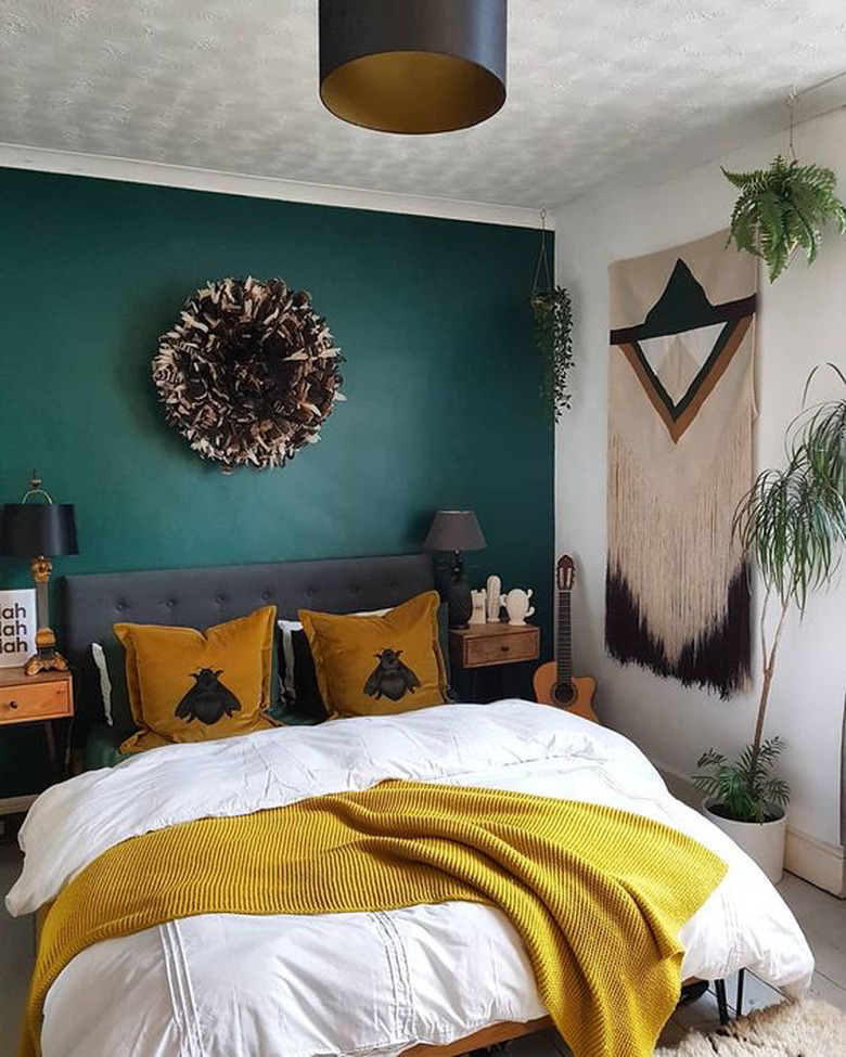 Bedroom with teal accent wall
