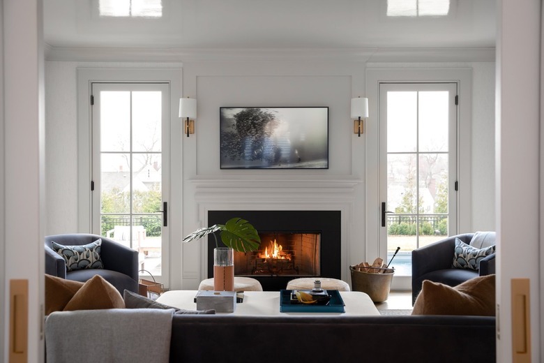 brown candles and pillows warm up the space