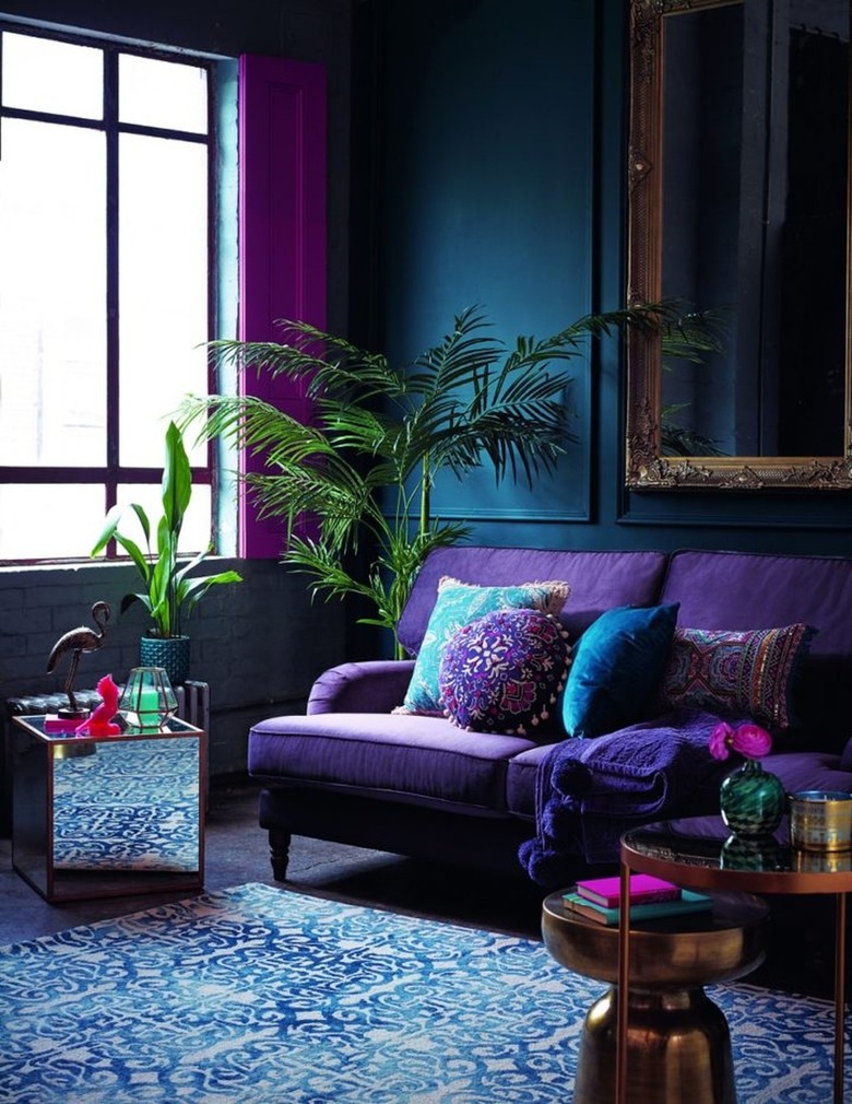 Dark jewel toned living room with blues