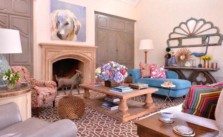 Living room with brown carpet and blue chaise lounge