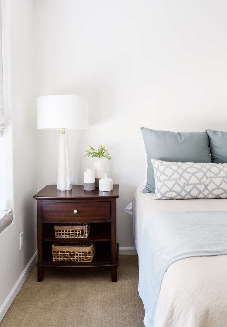 Bedroom with brown carpet and white walls