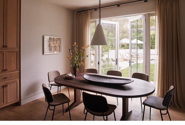 dining room with mauve walls and brown furniture