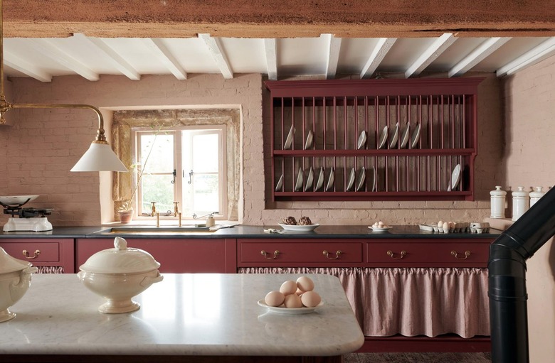 Kitchen with burgundy cabinets.