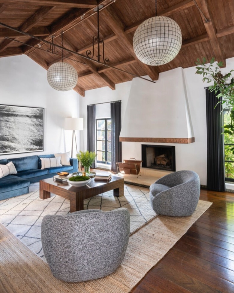 Living room with dark wood beamed ceiling