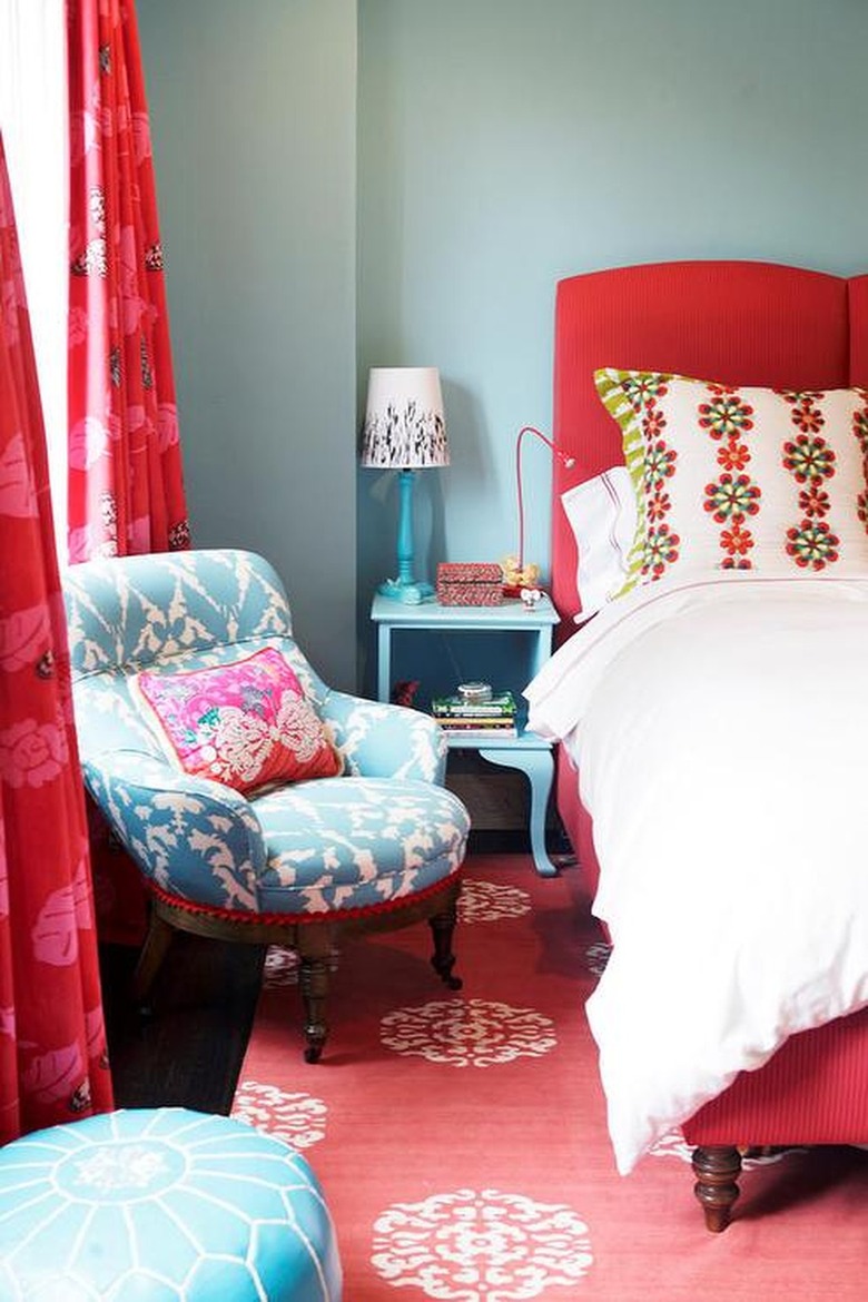Bedroom with bold red bed frame