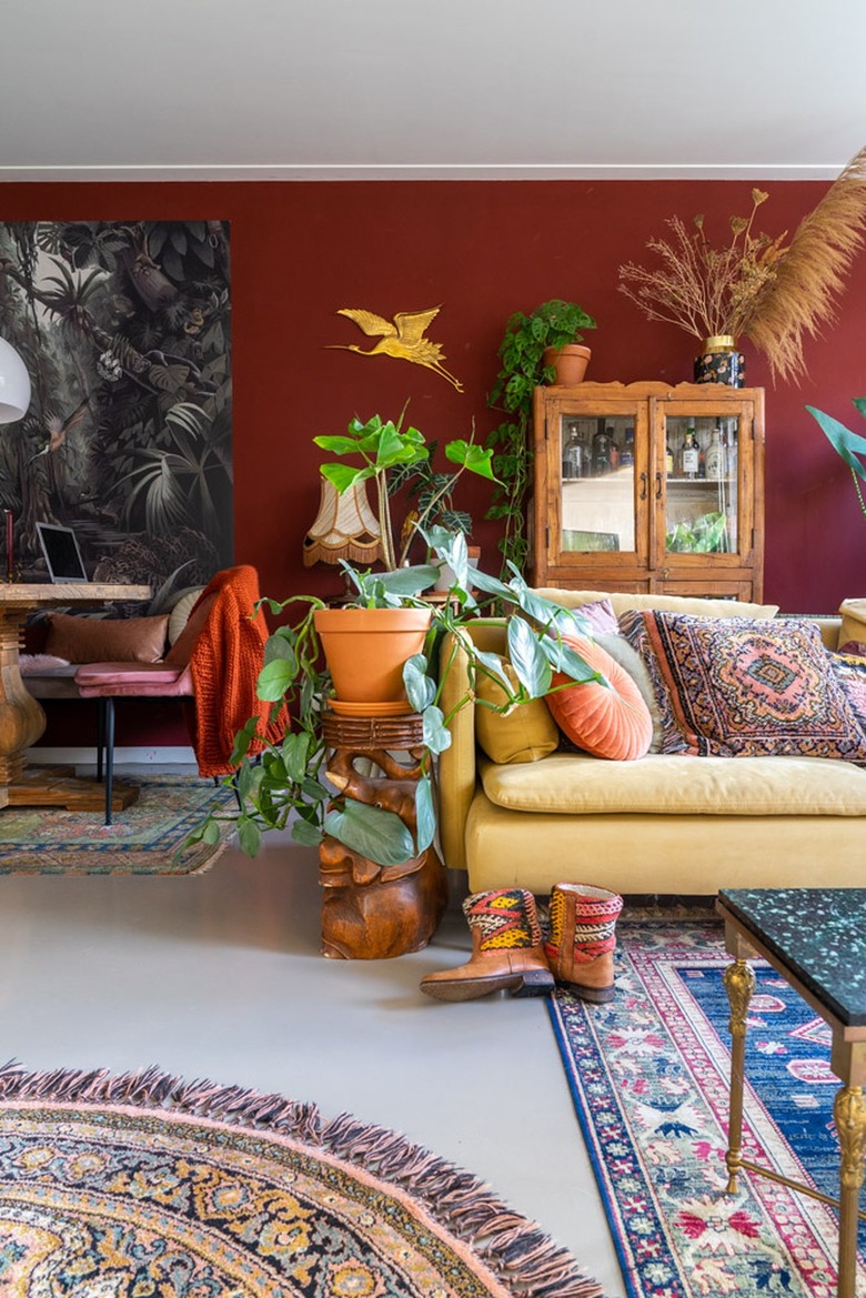 Ecclectic living room with yellow couch and orange accents.