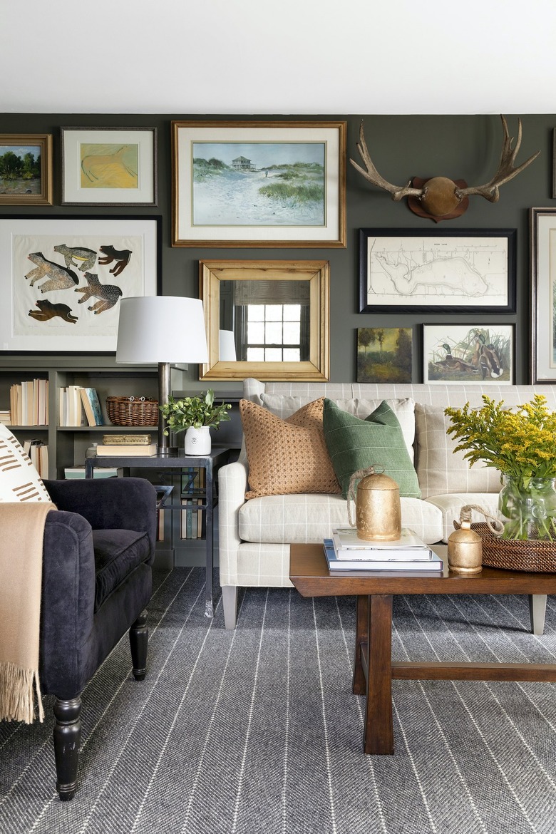 living room with olive green walls and purple armchair by Bria Hammel Interiors