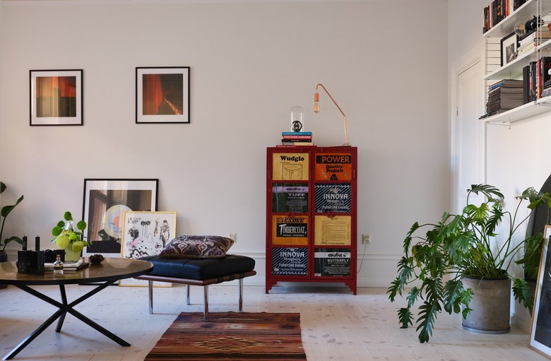 Room with greige walls and red accent cabinet