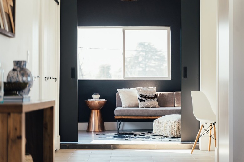 rose gold side table in black living room