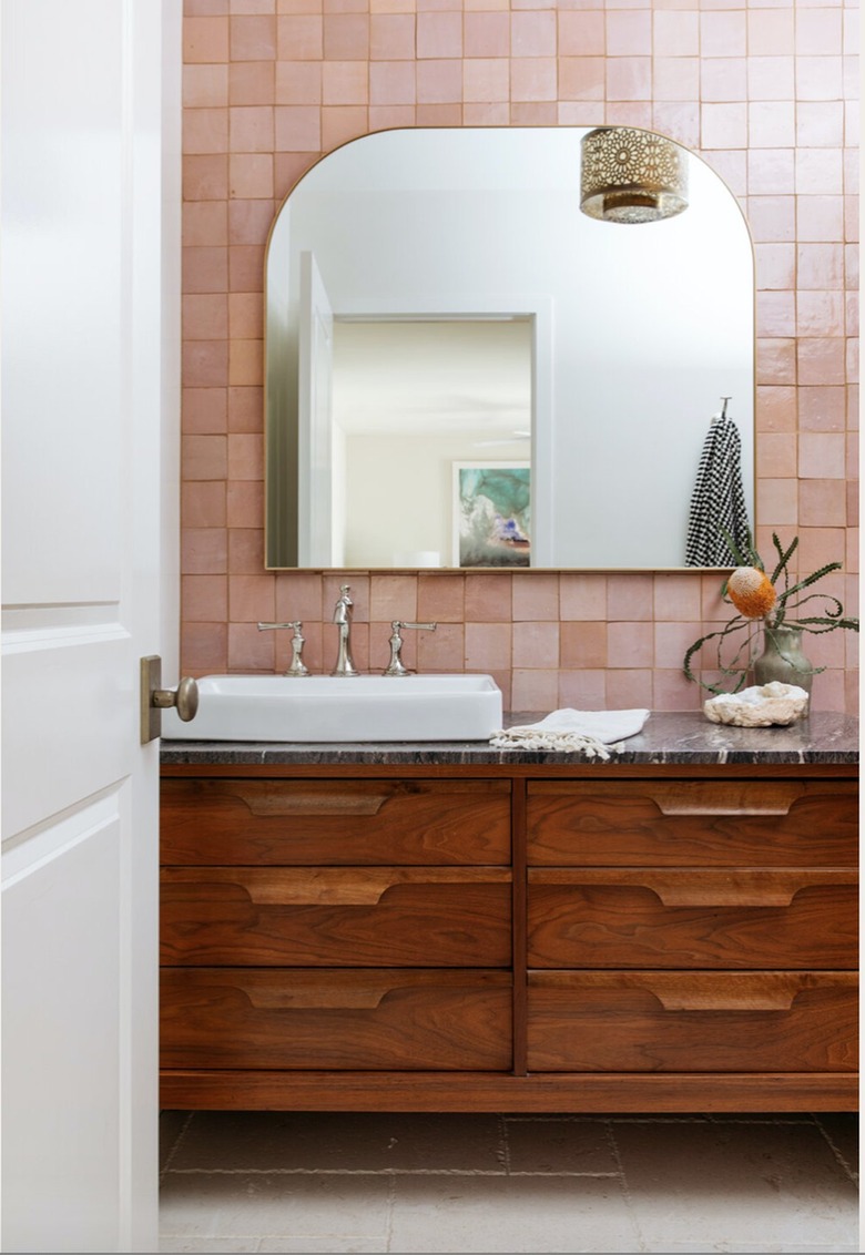 boho bathroom with wall of rose gold zeolite tile