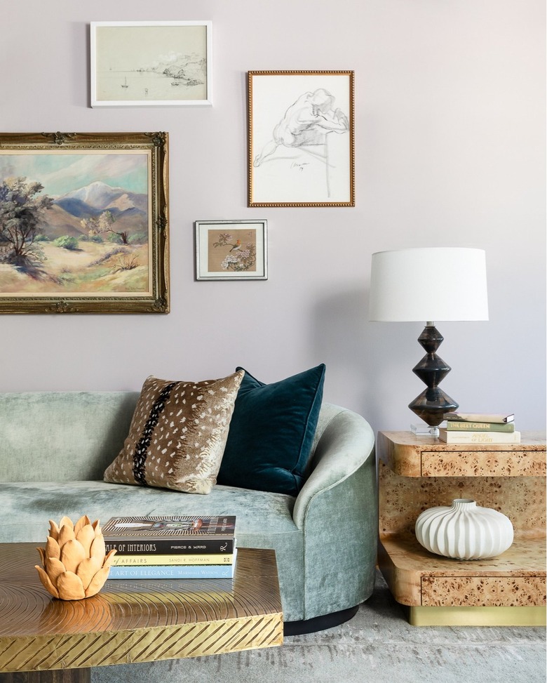 Shot of a living room with light colored walls and wall art