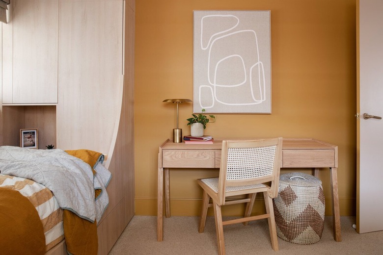 mustard yellow wall with beige decor details