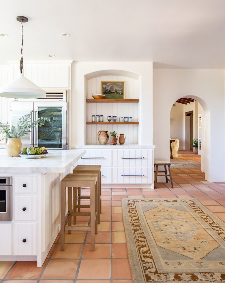 White kitchen with tan barstools