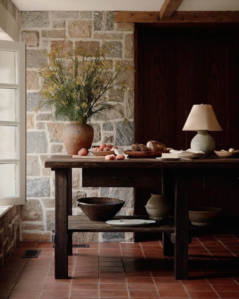 Saltillo floor tile in kitchen with dark brown accents