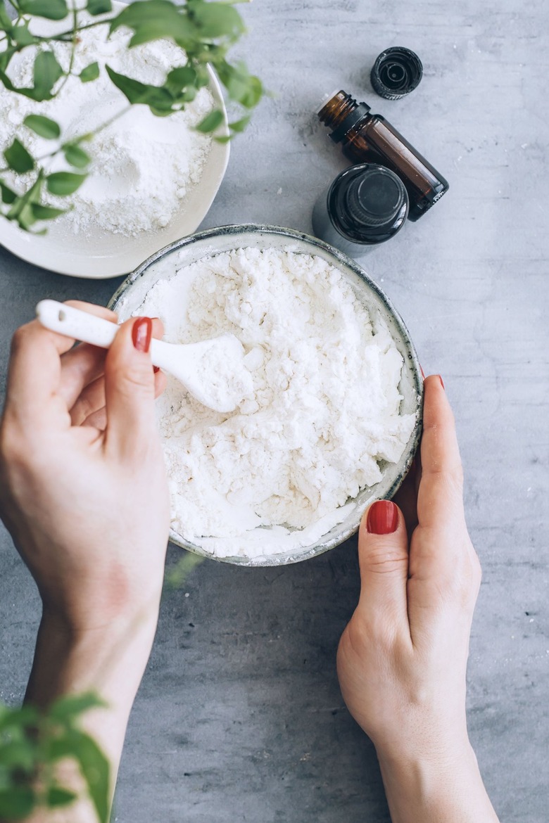 mixing essential oils into the baking soda and cornstarch mix