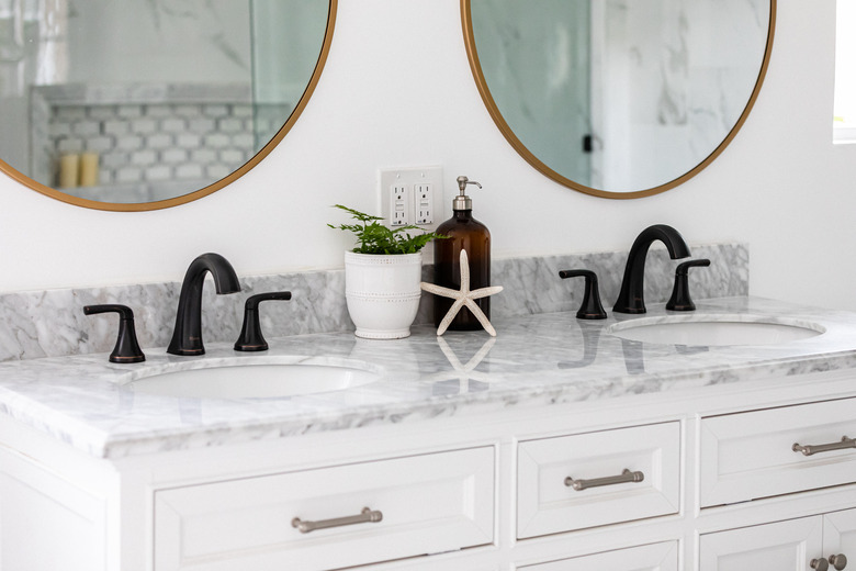 white vanity with marble counters