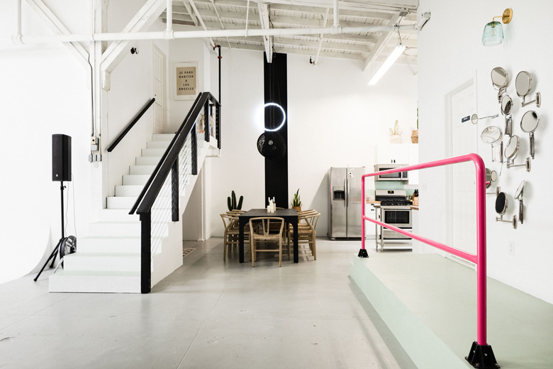 open room with neon pink handrail