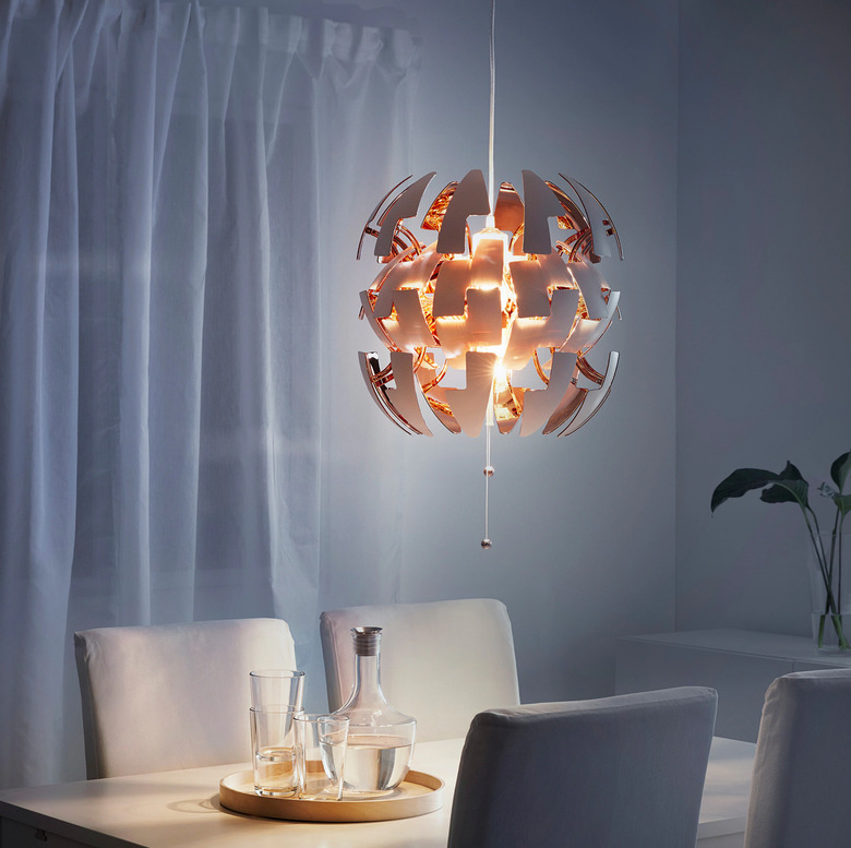 Copper and white contemporary dining room lighting from IKEA above table