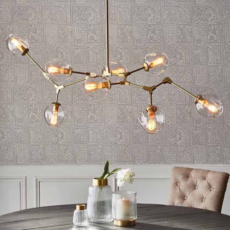 Brass and glass contemporary dining room lighting with branch chandelier over table