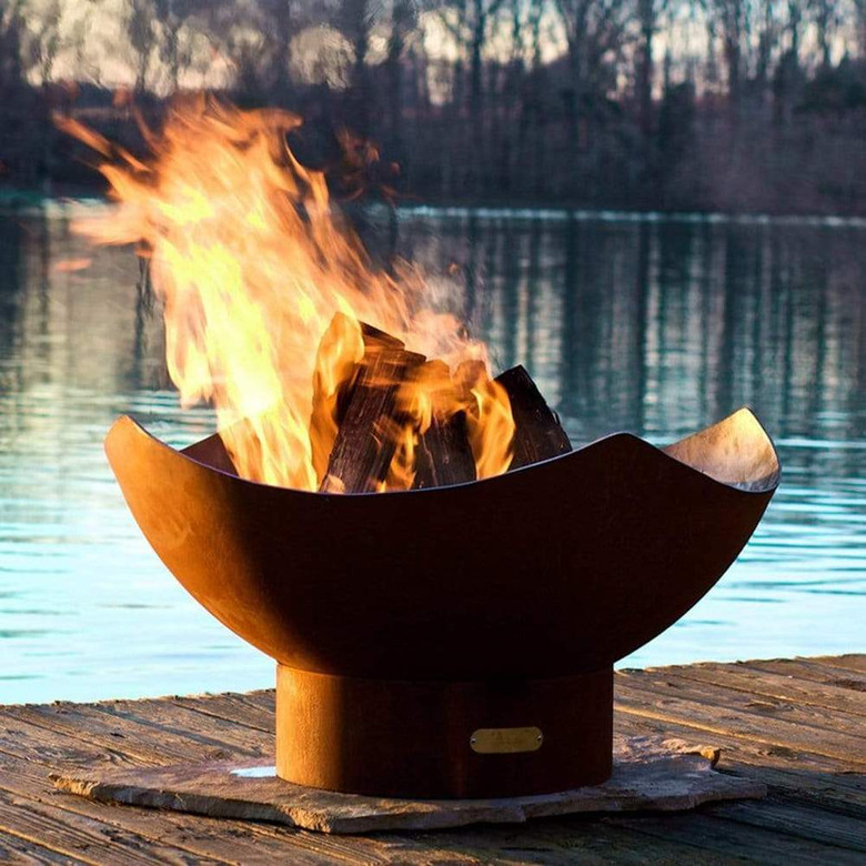 sculptural contemporary fire pit with rich iron patina