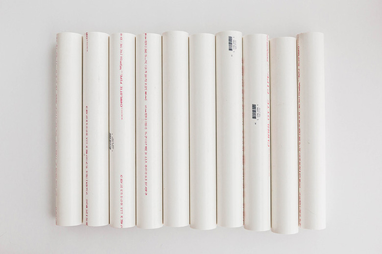 Cut the pipes to size using a saw.