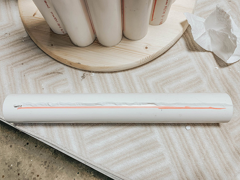 Use construction adhesive to attach the pipes together.
