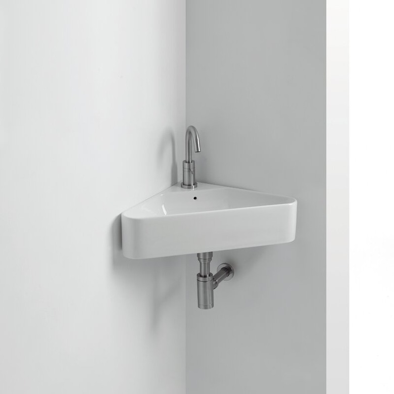 Modern minimalist white corner bathroom sink with linear details