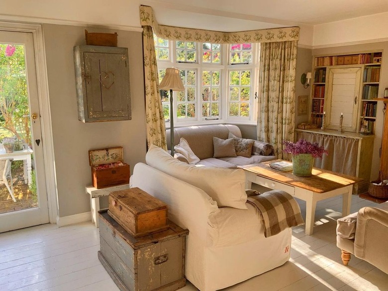 living room with wooden boxes stacked behind sofa
