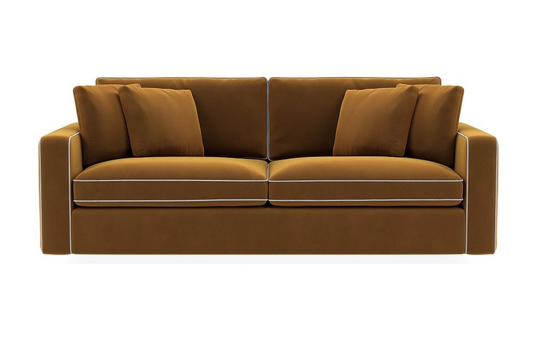 orange couch with contrast piping