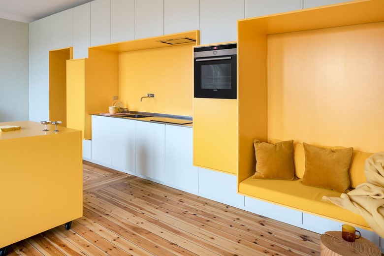 Chrome yellow countertops with white cabinets in a modern