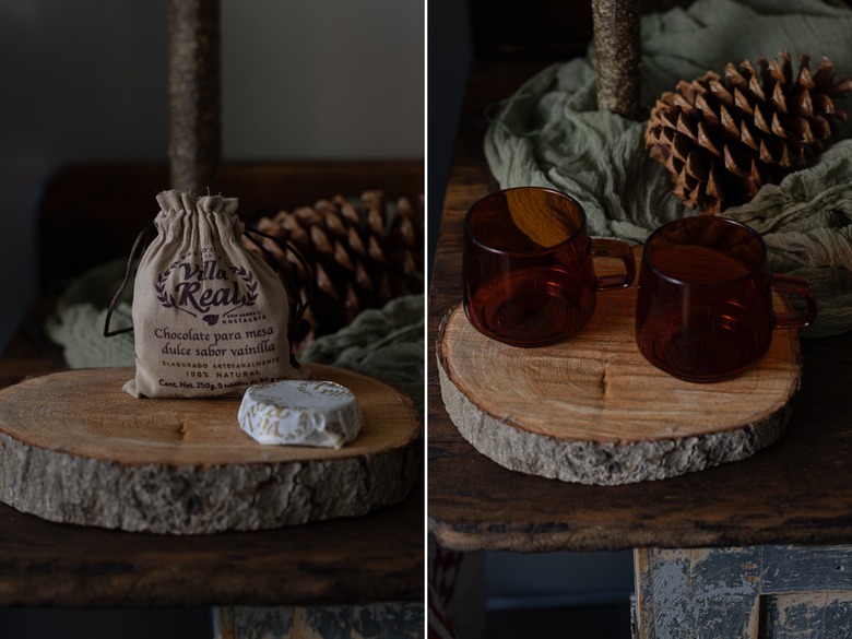 hot chocolate next to amber glass mugs