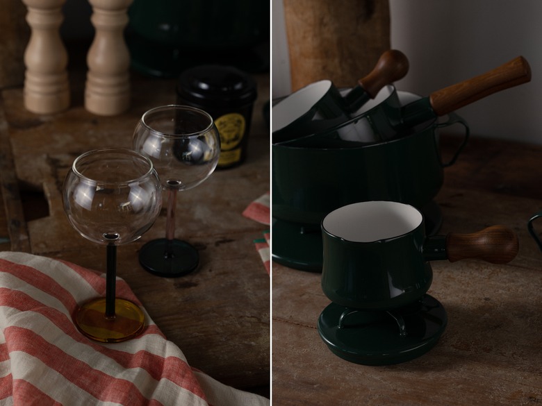 colorful small wine glasses next to green cookware set