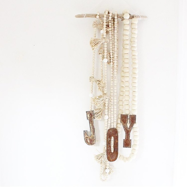 Cream and rust winter wall hanging with wood beads