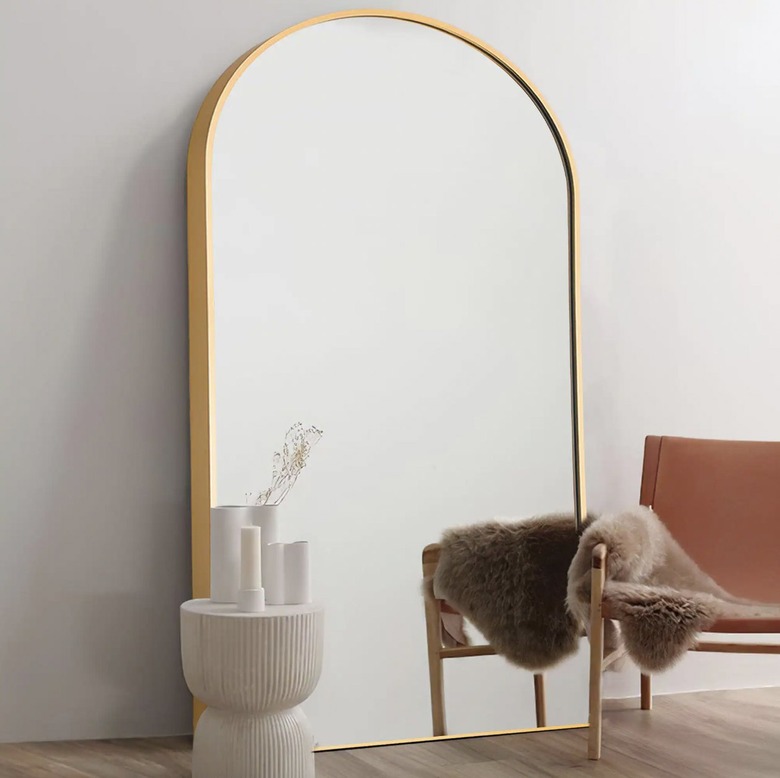 arched gold mirror