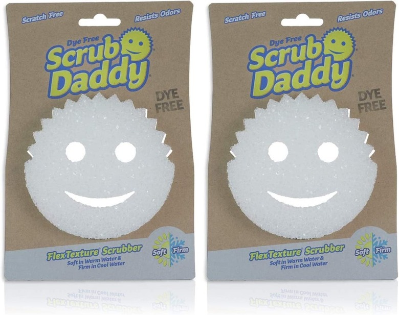 Two packages of white Scrub Daddy smiley face sponges.