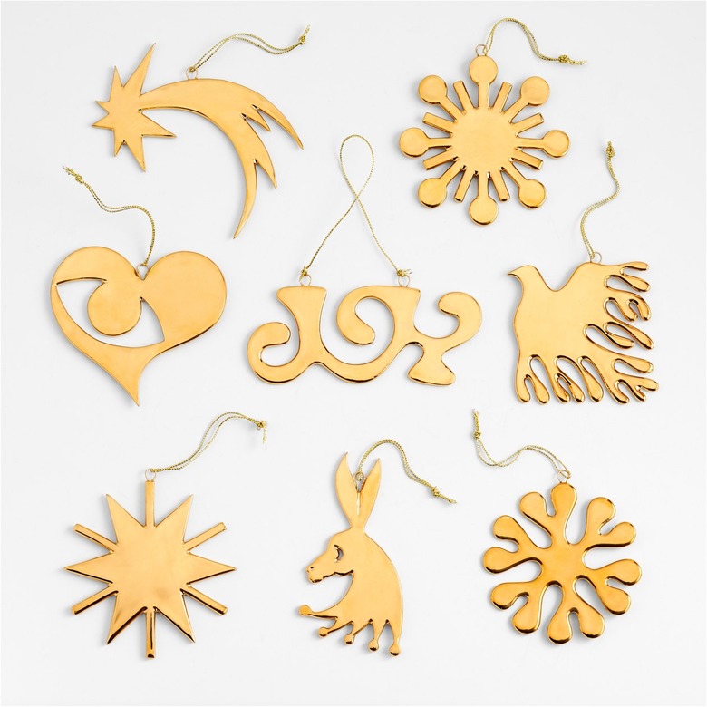A gold ornament set featuring three suns