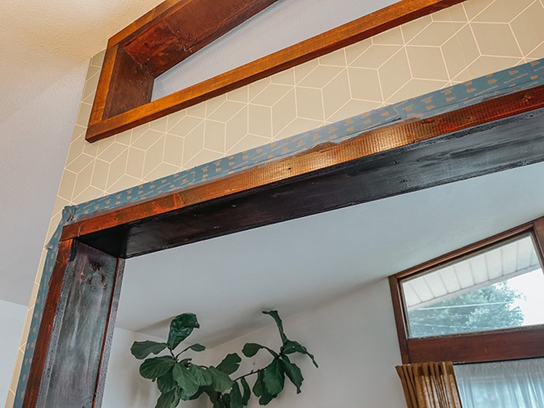 Add stain to the unfinished wood trim of the cutout.