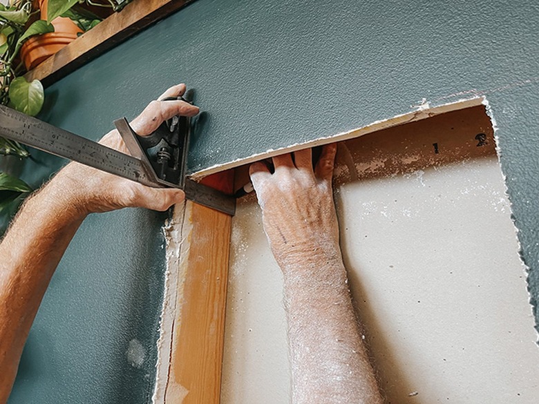 Mark the corners for the other side of the cutout using a square.