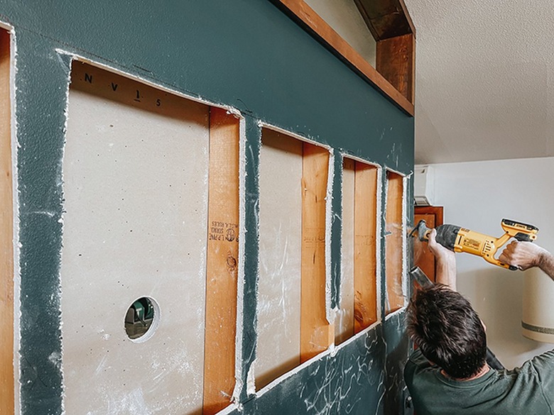 Cut out the first side of your cutout between the studs.