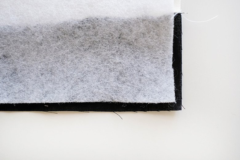 place the pellon on the wrong side of the quilt top.