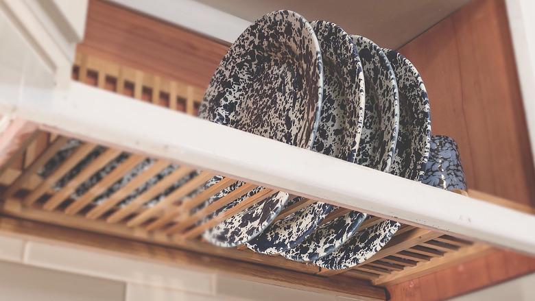 Dishes drying in dish rack