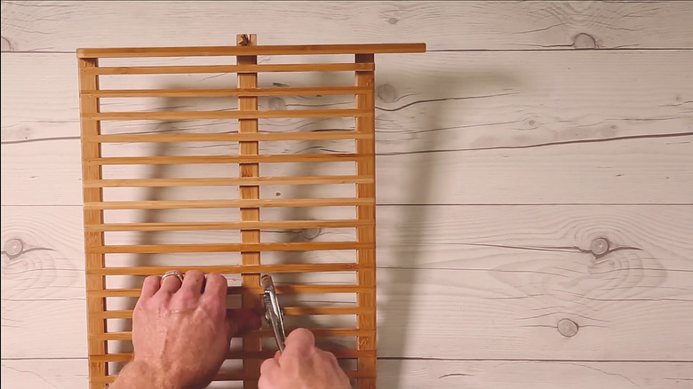 Prying center support beam off dish rack