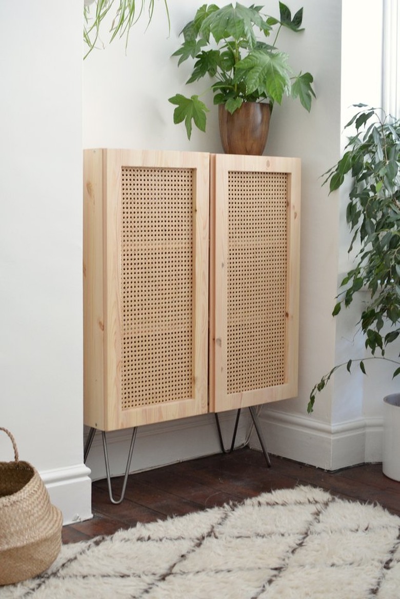 Wood cabinet with cane doors