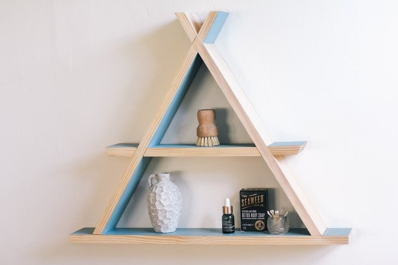 A-frame wood shelf on wall.
