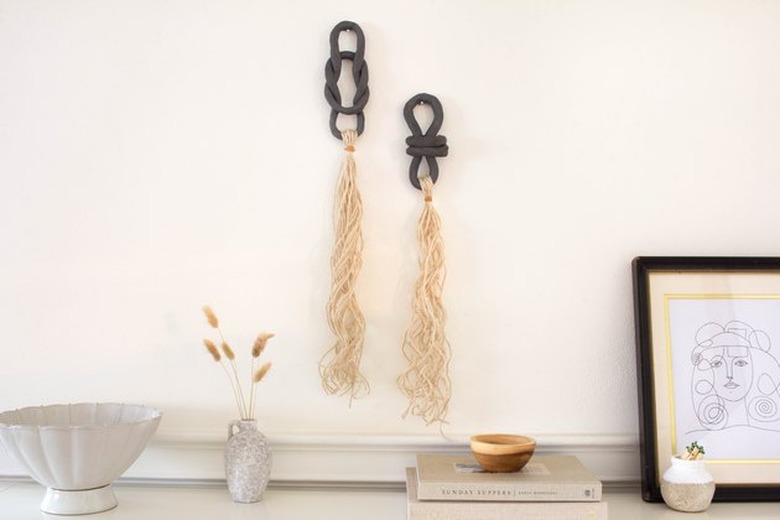 Clay and tassel wall hanging.