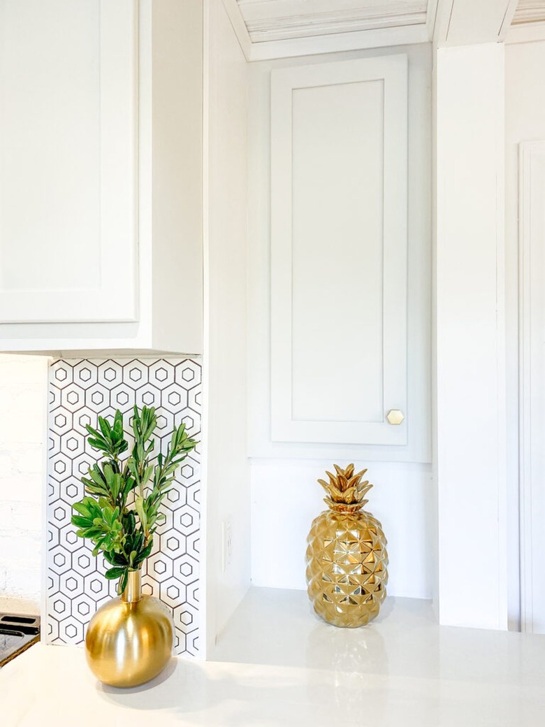 electrical panel hidden behind cabinet door