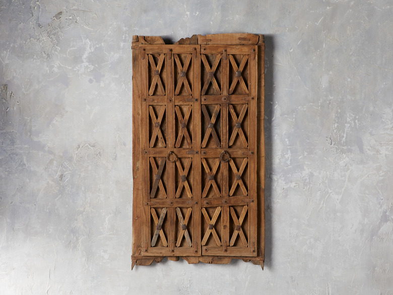 Piece old door with X details and brass circular handles