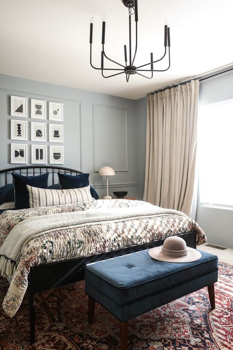 A gray blue room with linen curtains.