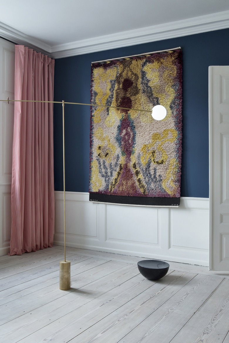 blue wall with red and white curtain